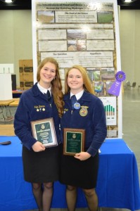 Allison Smith and Julia Barnes proudly display their awards.