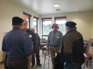 Senior Resource Conservation Specialist Clair Klock and Director Emeritus Mike Weinberg green visitors in the entry hall of the new building.