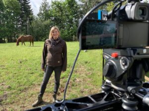 Reische at her horse property filming videos demonstrating conservation practices.