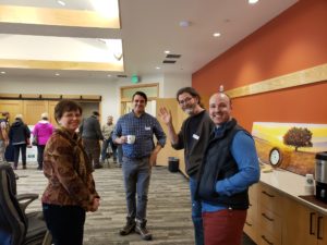 Acting General Manager Lisa Kilders joins Staff Nathan Tucker, Board Chair Jeff Becker, and partner Eben Polk in the conference room.