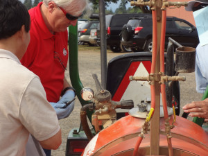 Checking pressure gauge during 2014 sprayer calibration workshop