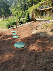 Access lids for septic tank for a recently completed construction